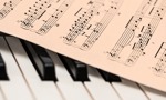 Music lessons - Picture of piano and music sheet