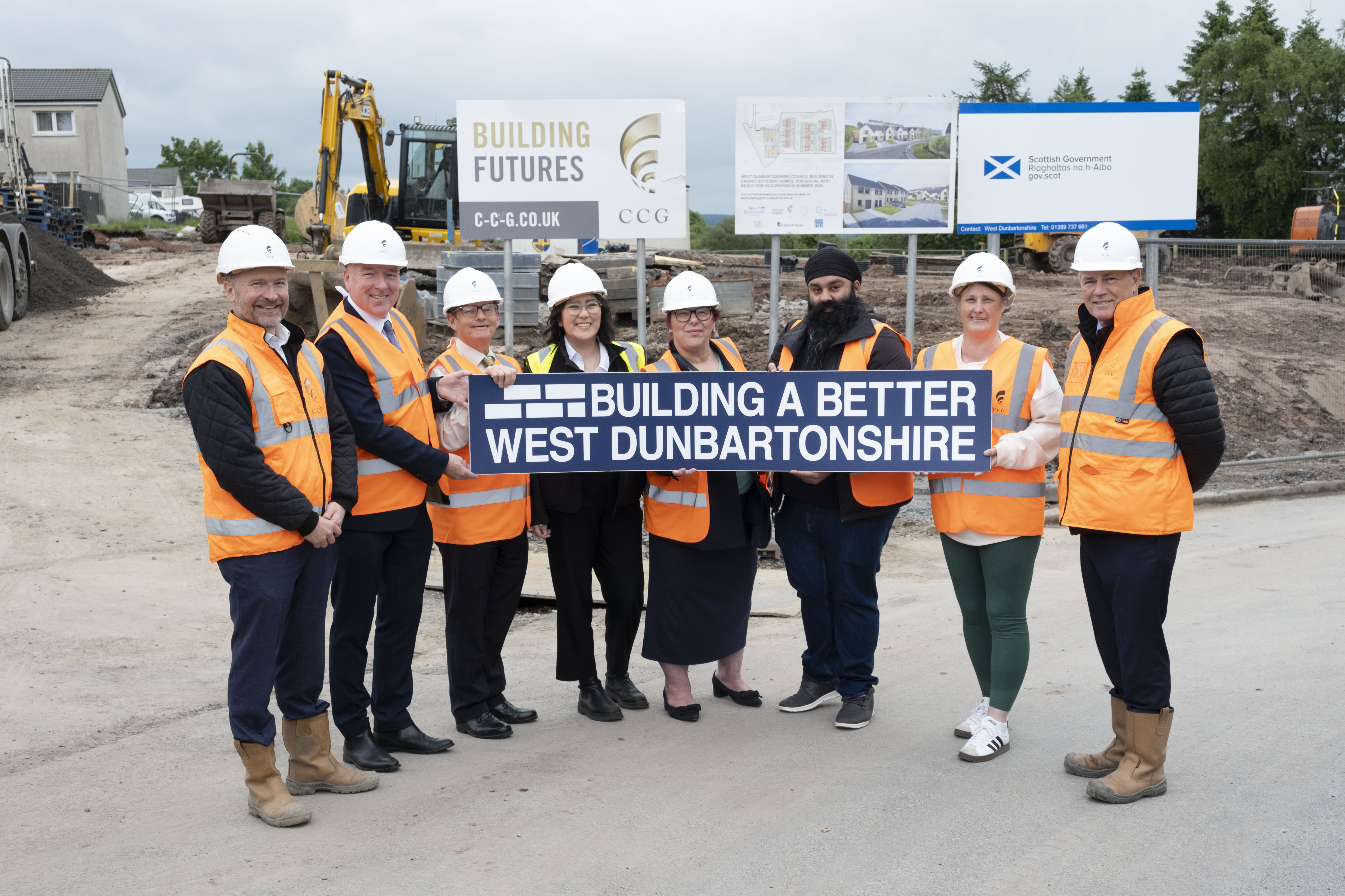 Representatives from West Dunbartonshire Council and contractors CCG at the site of new homes in Pappert 