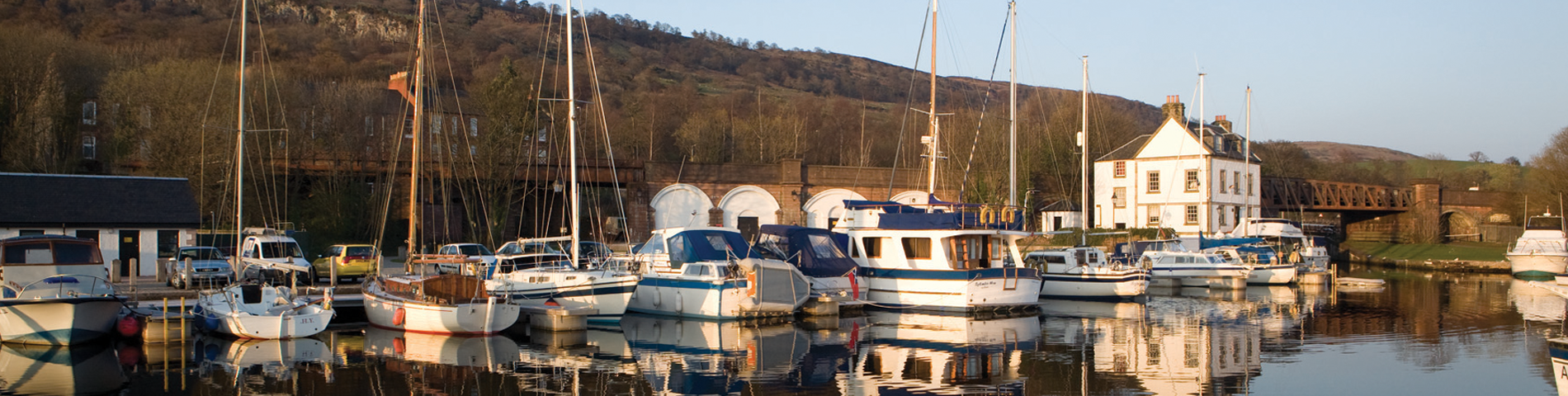 Bowling Harbour, house and boats with there reflection on the water