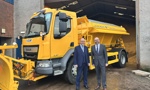 Councillor O'Neill and Councillor McBride standing beside Gritter