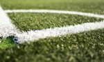 White lines marking out the corner of an artificial football pitch