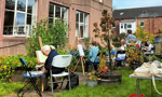 People painting outside in a garden