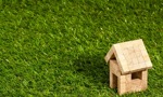 Small wooden house on artificial grass